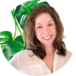 Julie from Sprouts and Stems' headshot with leaves in the background